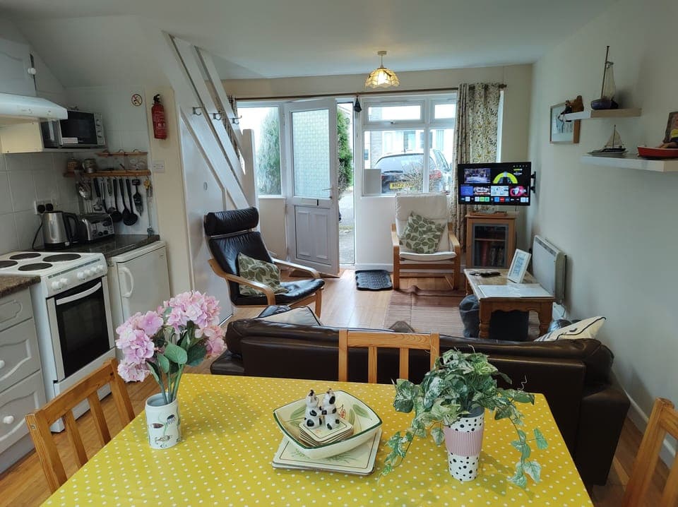 Lounge/dining area with streaming ready TV : view towards front windows