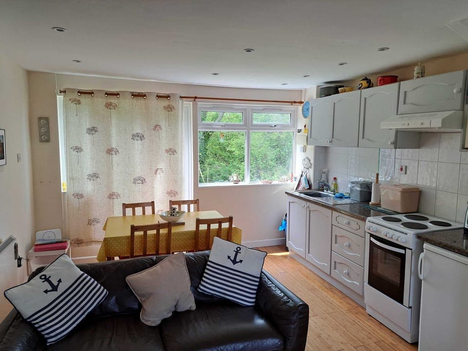 Lounge with dining area/kitchen: view towards rear windows
