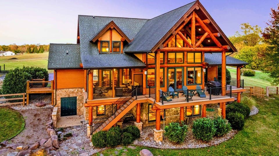 Experience the charm of this luxurious log cabin with stunning architecture, spacious balconies, and breathtaking views of the surrounding nature.