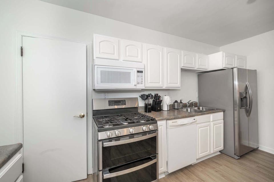 The airy kitchen offers ample space & all the comforts of home