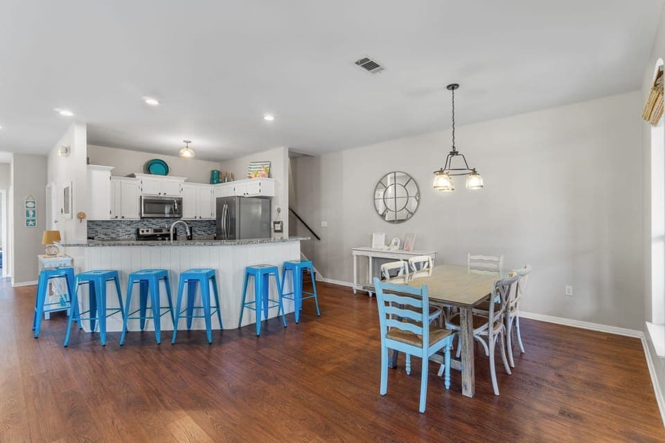 To the right of the entrance is the dining area with additional counter seating