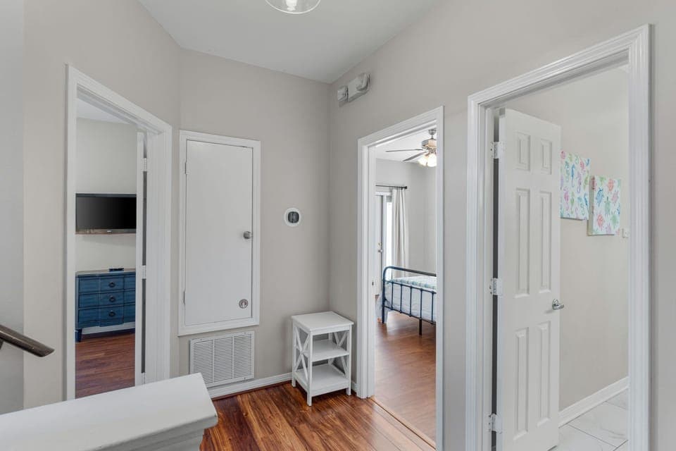 The second floor landing has access to two king bedrooms and a hall bathroom