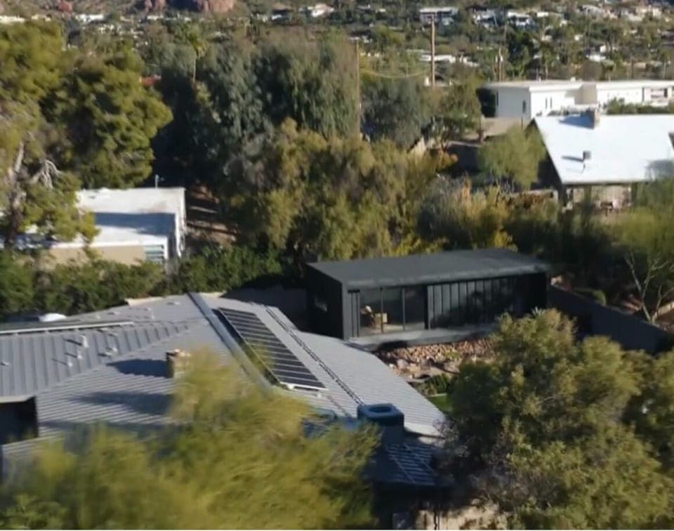 Drone view of guest house setting with Camelback in background