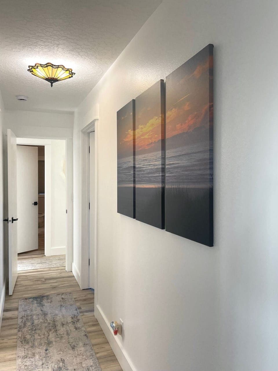 Hallway provides access to bedroom 3 and bathroom 3 across the way.