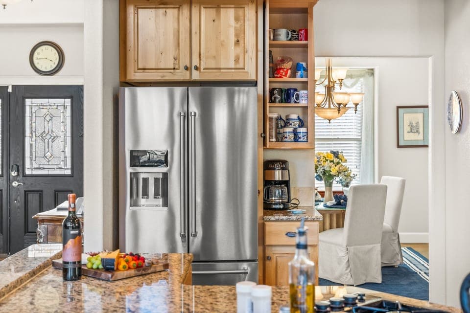 Top of the line kitchen with stainless steel appliances and granite countertops.