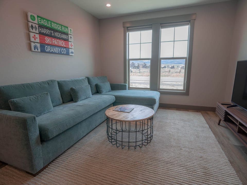 Lower-level living area features beautiful views of the Nordic track and nearby mountains.