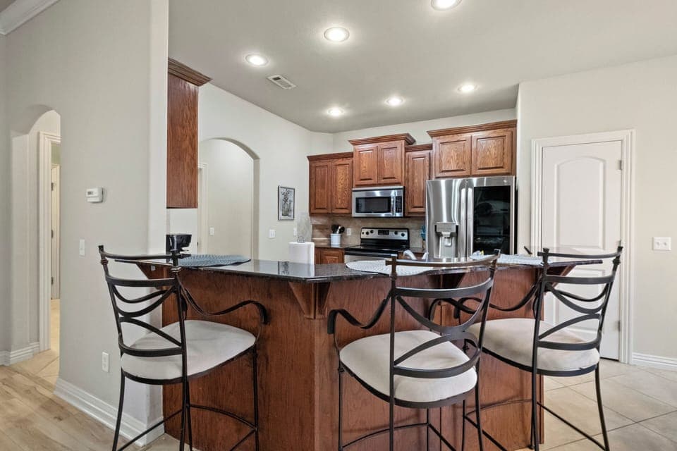 Additional barstool seating for 3 at the kitchen counter!