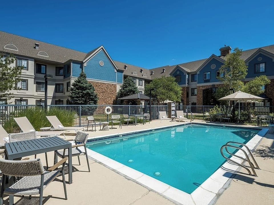 Dive into sun-soaked relaxation beside the sparkling outdoor pool.