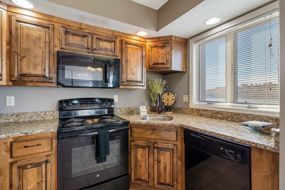 The kitchen offers ample storage & all the comforts of home