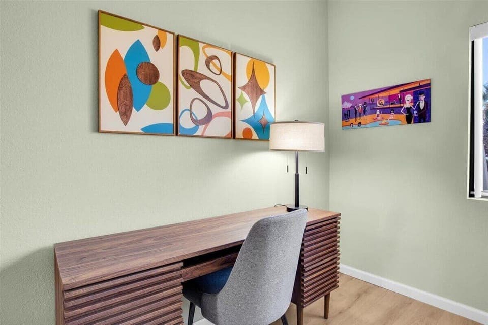 Bright and airy guest bedroom featuring a comfortable Queen bed, a dedicated desk for work or leisure, and ample storage for your belongings. Perfect for a relaxing stay or productive getaway!