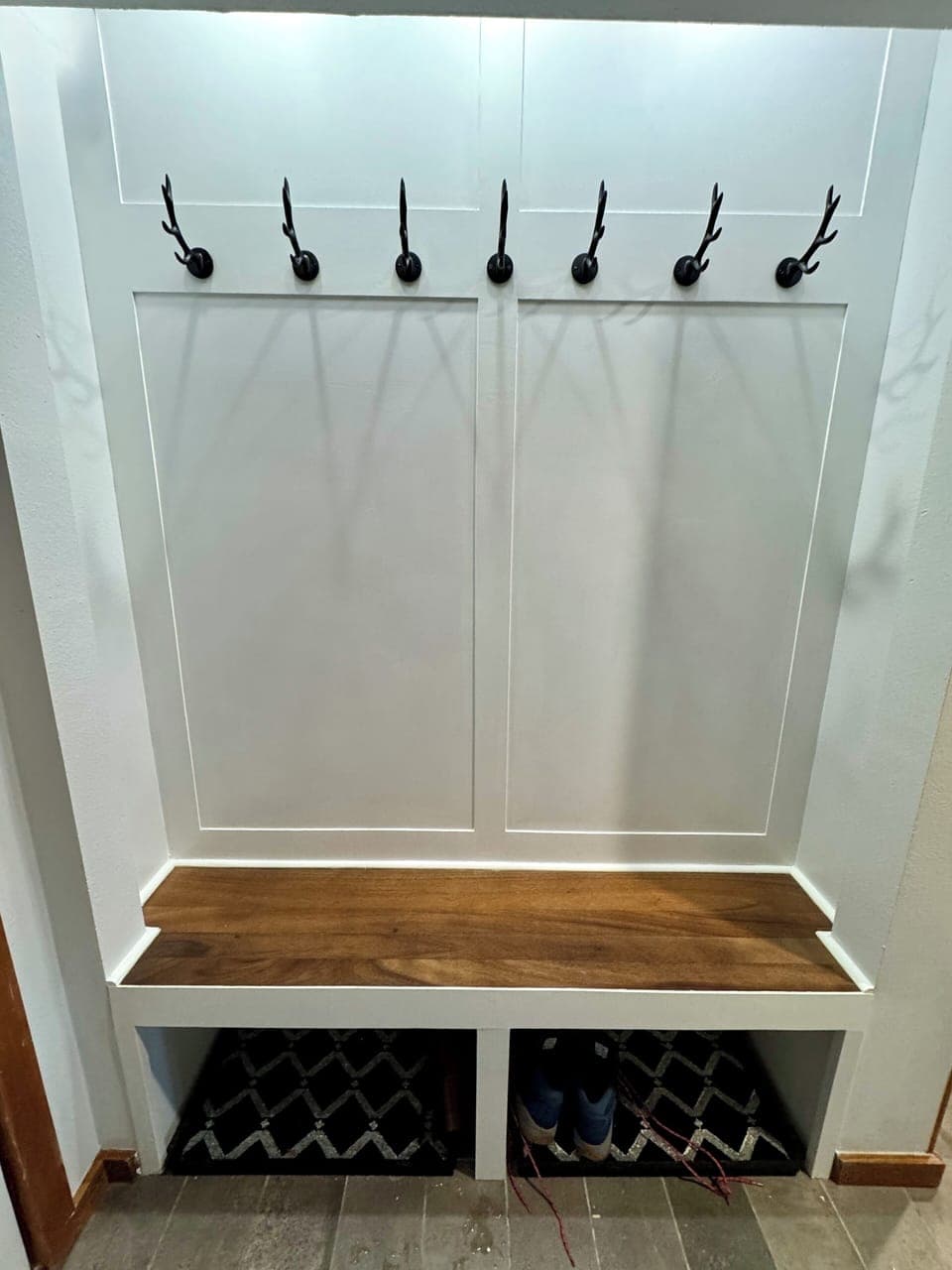 Custom built mud area in the entry w/ boot tray and hooks