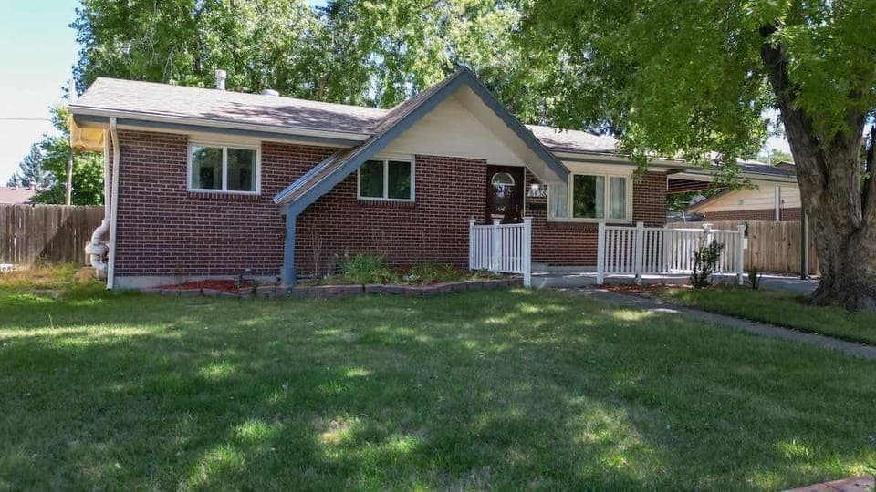 The fenced yard provides privacy and security, making it a perfect space for outdoor activities, relaxation, and pets to roam freely.