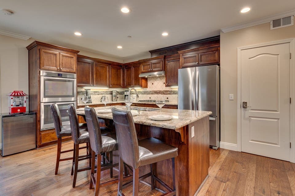 Kitchen area with stainless-steel appliances and large island