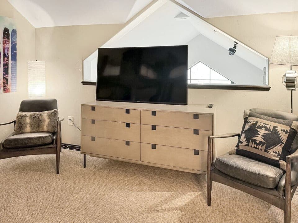 The loft becomes a gaming paradise with twin XL bunks, cozy sitting area, and 55` TV - perfect for bringing your console. Overlooking the living area below, the ceiling fan keeps air flowing comfortably
