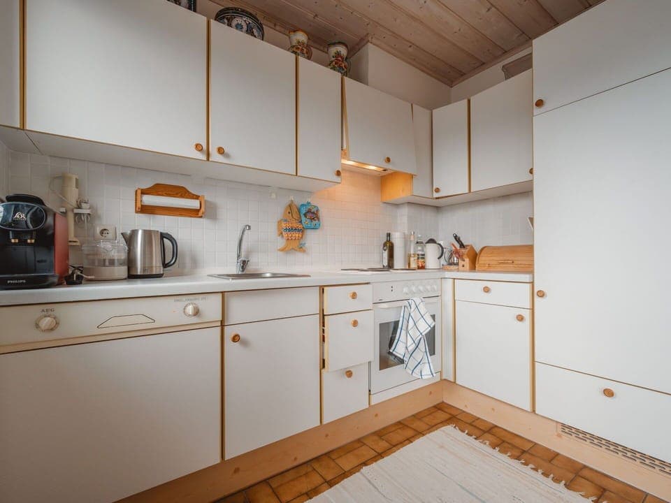 Wood, Flooring, Cabinetry, Interior Design, Kitchen, Kitchen Appliance, Countertop, Floor, Major Appliance, Drawer