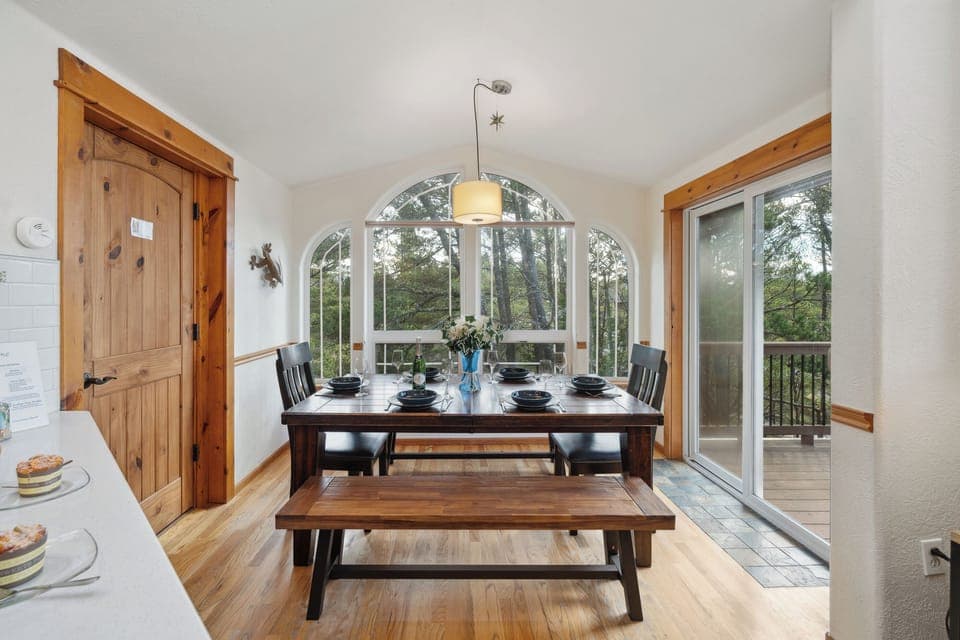 Open living space with,Kitchen with breakfast bar, dining room and  Living room with Gas fireplace, Roku TV, and access to upper deck.