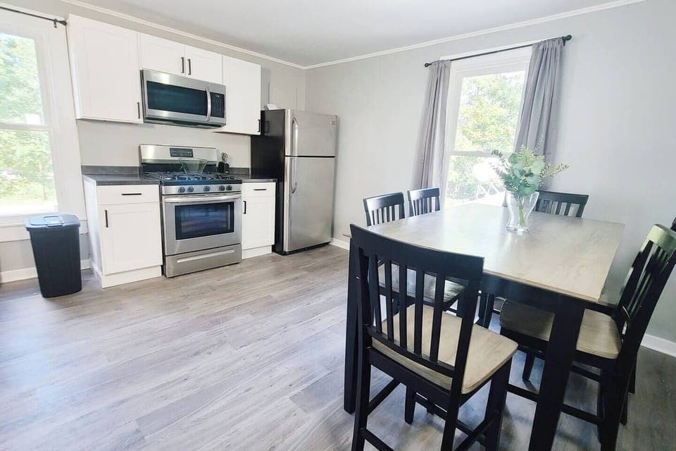 Stylish 6-seater dining area facing the kitchen, creating an open and inviting space perfect for meals and entertaining.