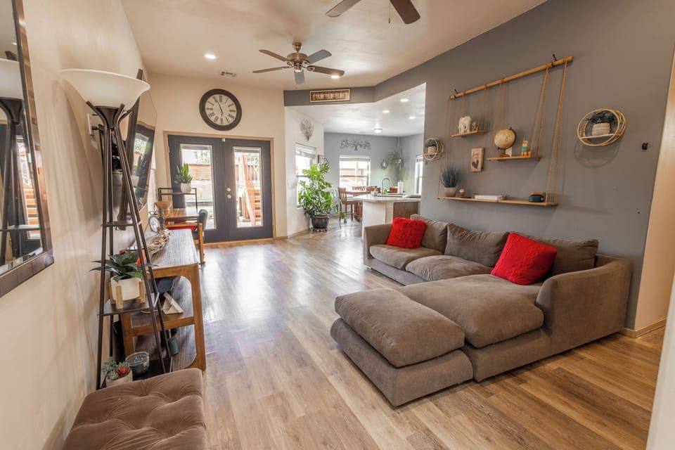 Welcoming living room with Smart TV, 2 ceiling fans, French doors to backyard