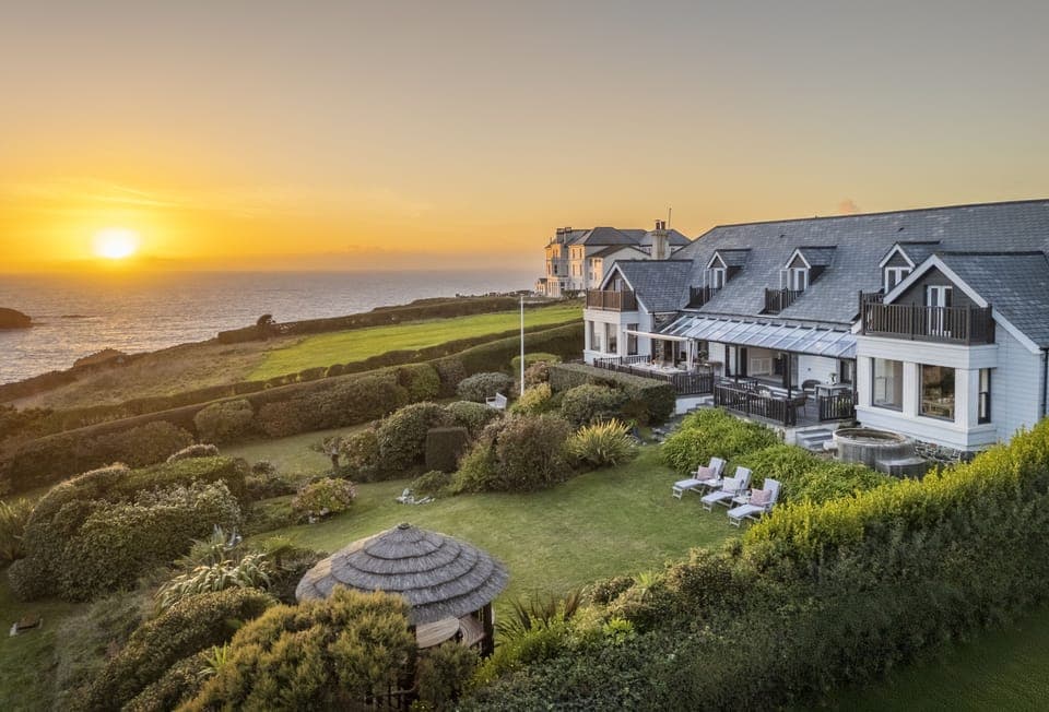 Welcome to Henscath House, an exquisite family retreat perched atop the breathtaking Mullion Cove