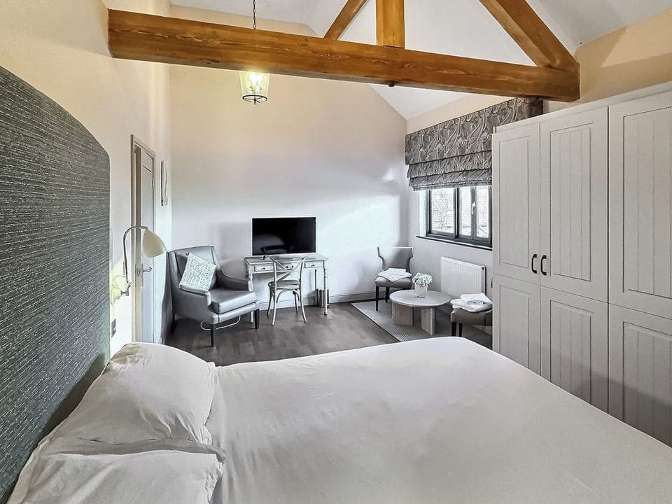 Kingsized bedroom with view to paddock and village | Valentines Cottage - Home Farm Retreats, Kirk Hammerton, near York