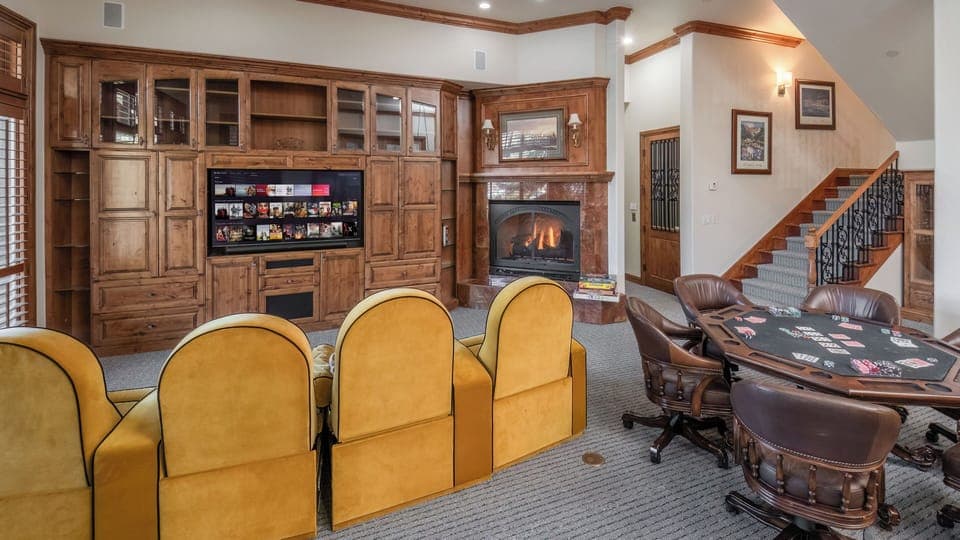 Entertainment Room, Lower Level - Theater seating with poker table and built-in cabinetry