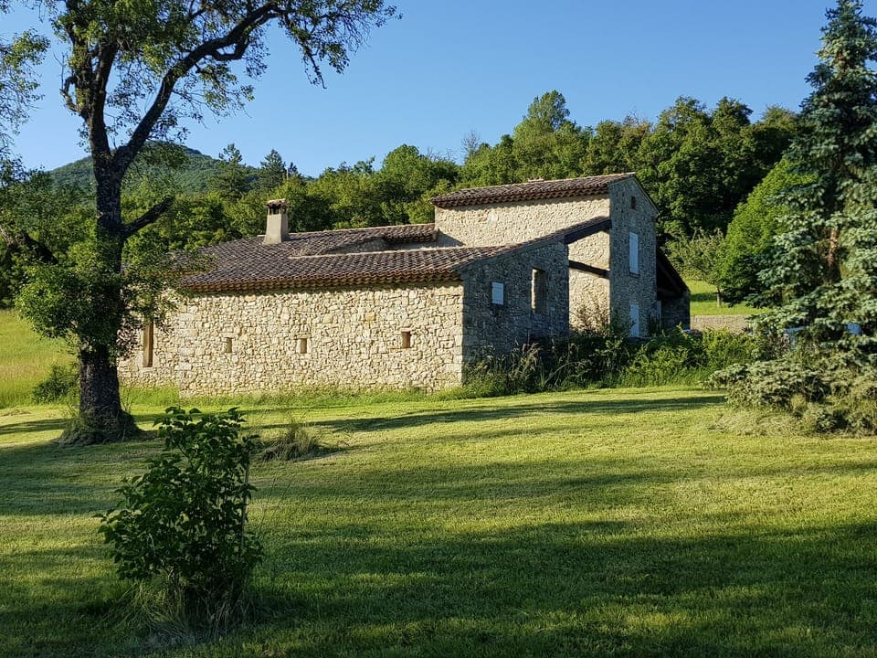 Stone house in a peaceful, green setting