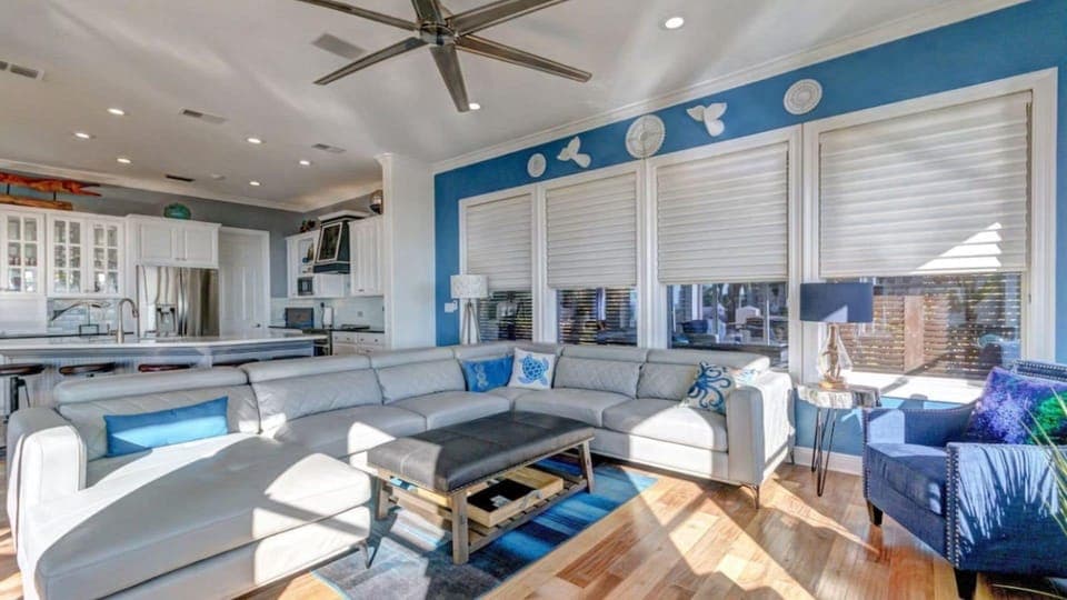 Your bright, coastal-inspired living room flows seamlessly into the modern kitchen, creating the perfect space for cooking and relaxing together.