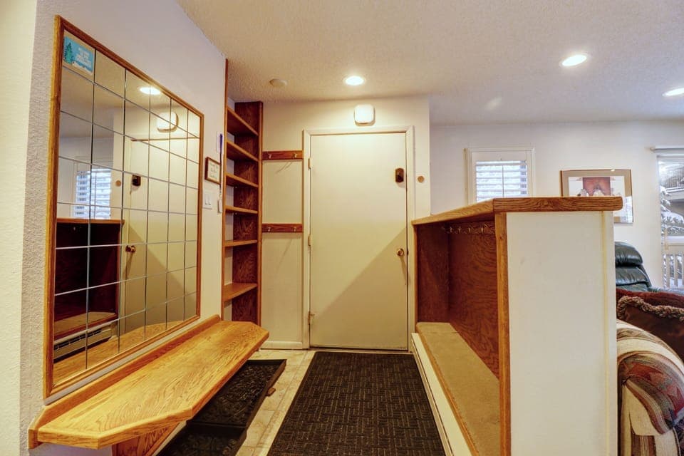 Entry way features ample storage and a bench for getting ski gear on and off!