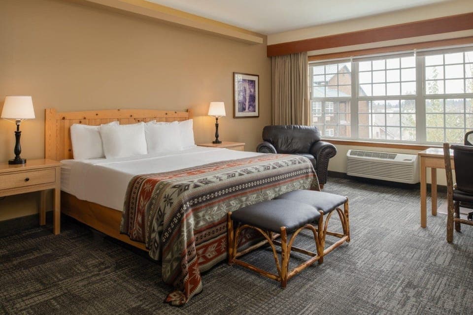 Wake up refreshed beside big windows and relaxing seating.