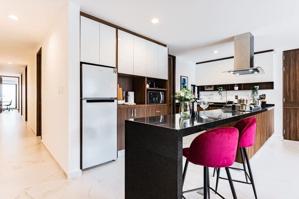 Wide hallway with stylish storage solutions and polished finishes