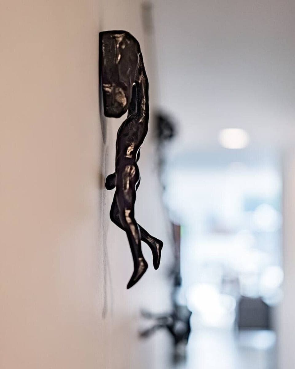 Artistic sculptures add character to the space, highlighting unique design elements