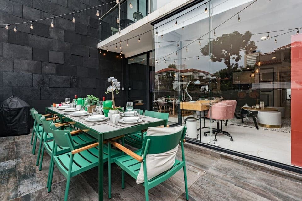 Patio dining space complete with string lights, creating a magical atmosphere for evening gatherings.