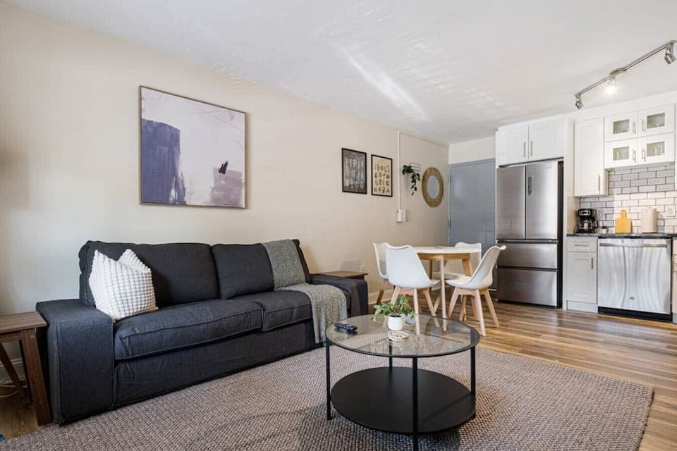 You feel at home as you settle into the living room, where the inviting atmosphere is perfect for lounging or entertaining.