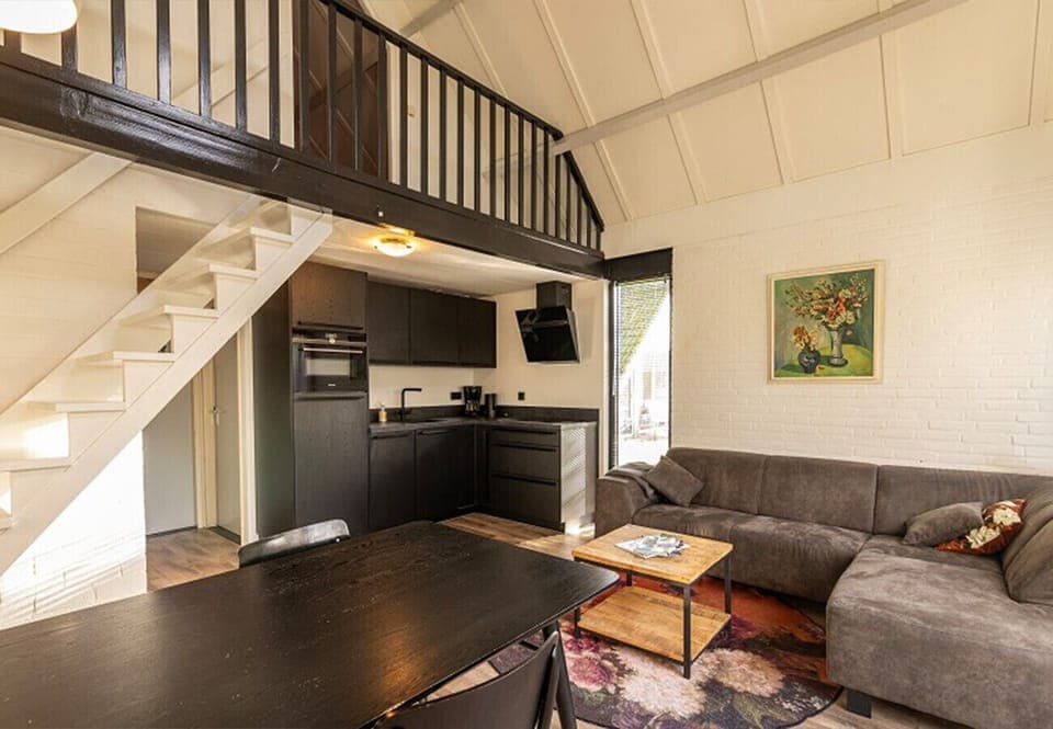 Bungalowpark Simpelveld – Delta 130 EEZZ Living room kitchen dining table