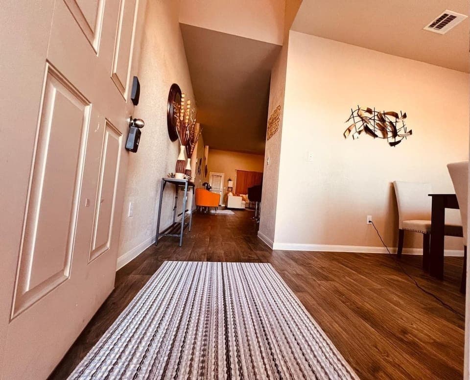 Entryway and Hallway: Modern and welcoming entryway with sleek flooring and stylish accents, offering a warm first impression as you prepare to explore nearby attractions like San Marcos Premium Outlets.