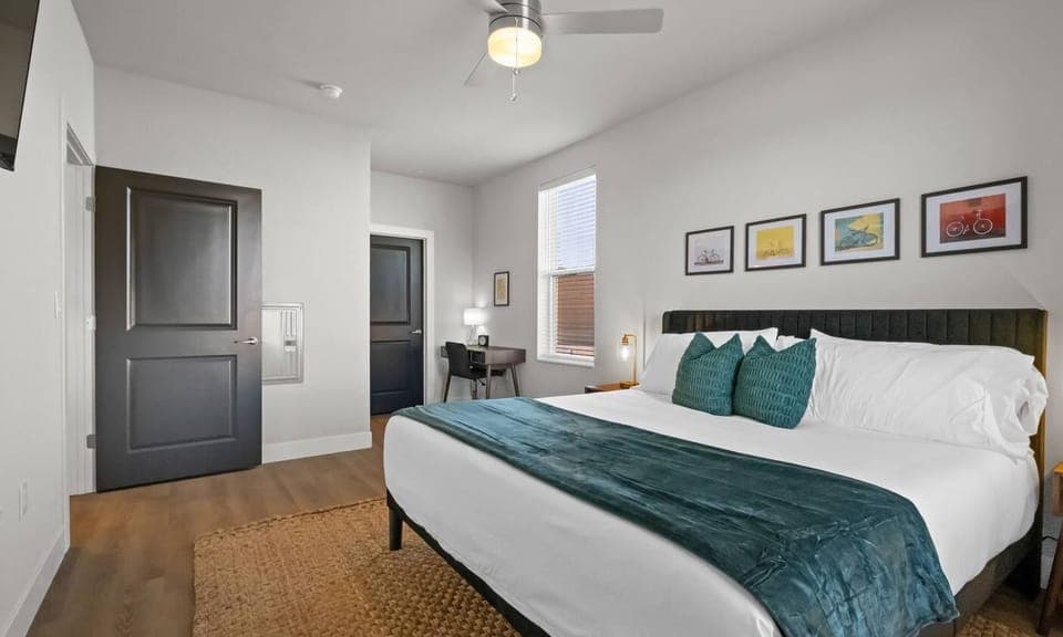 Step into the master suite, a luxurious haven designed for ultimate relaxation. Featuring a king-size bed adorned with soft, comfy blankets, this spacious retreat invites you to unwind and recharge. 