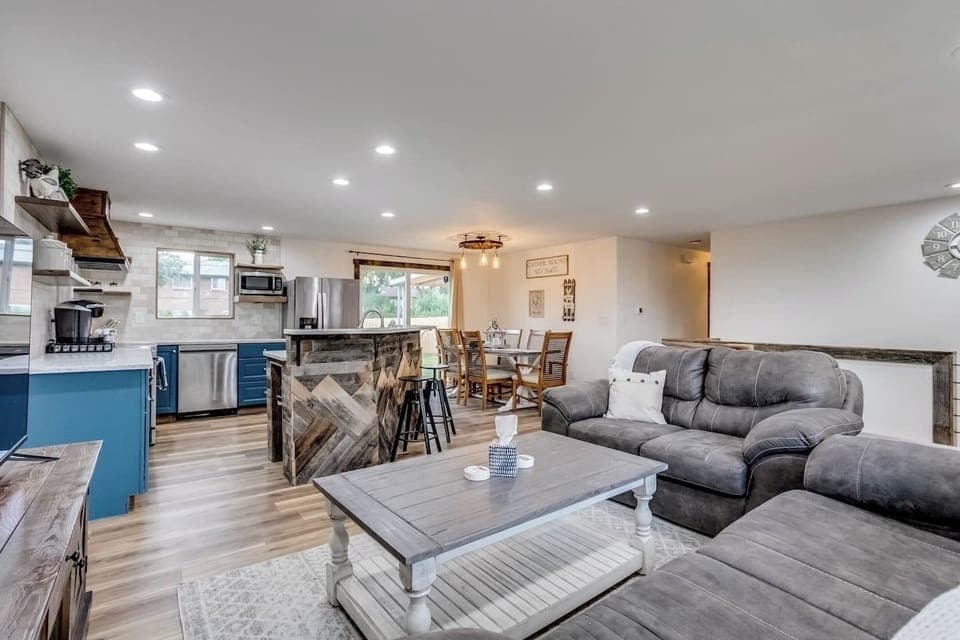 Upstairs living room: Open concept. Coasters. Roku Smart TV for streaming, no cable or satellite. DVD player and DVDs are available in the drawer of the TV stand. Open to dinning room and kitchen. Baby gate at the top of the stairs.