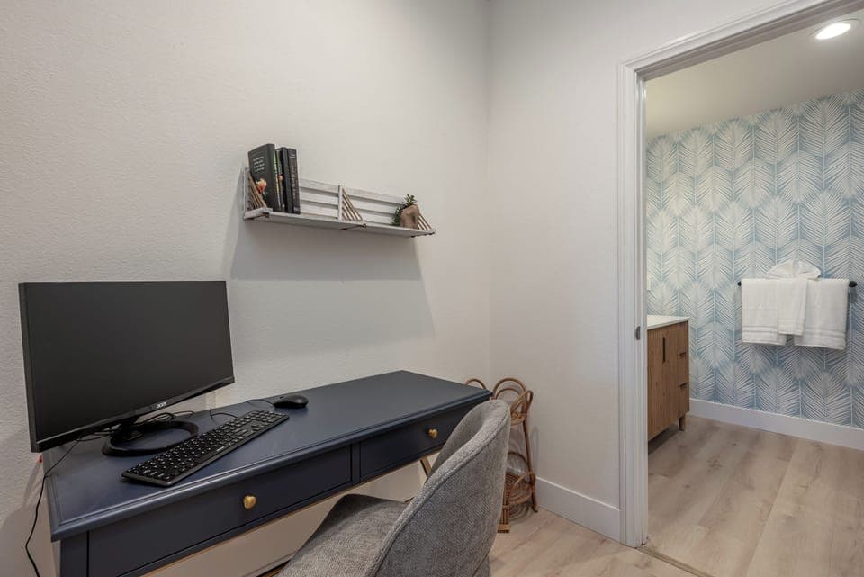 Queen suite workspace with HDMI monitor, usb keyboard and mouse