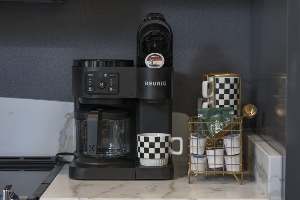 Coffee bar with Keurig cups as well as coffee pot capabilities.