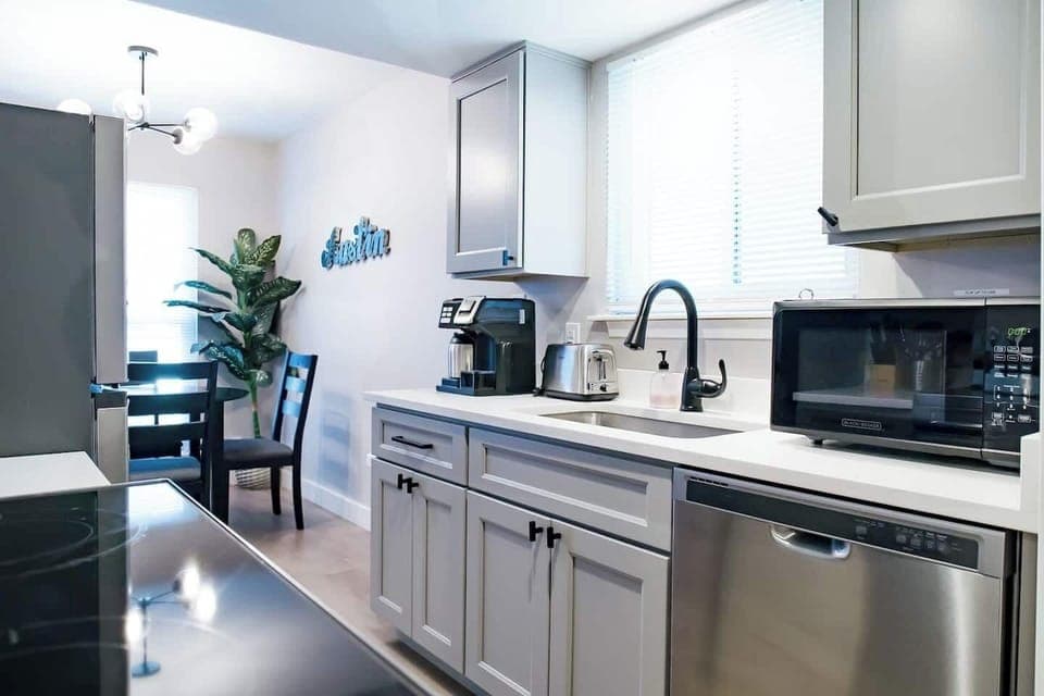 Fully stocked kitchen w Coffee Maker, Toaster, Microwave, Dishwasher, Oven, Range and Fridge