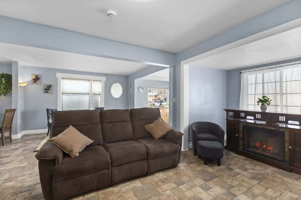Living room with reclining couch and electric fireplace