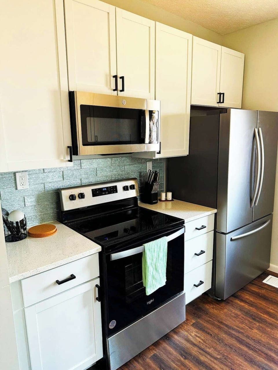 Kitchen with brand new cabinets, stainless steel appliances, countertops.