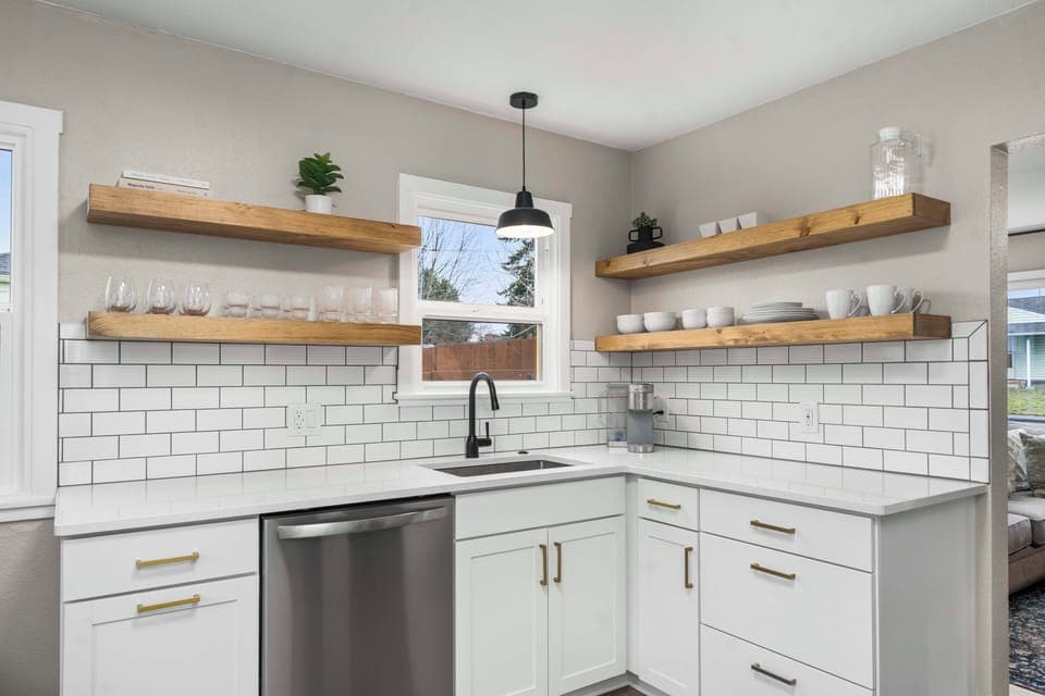 A deep sink with garbage disposal and dishwasher makes cleaning up a breeze. 