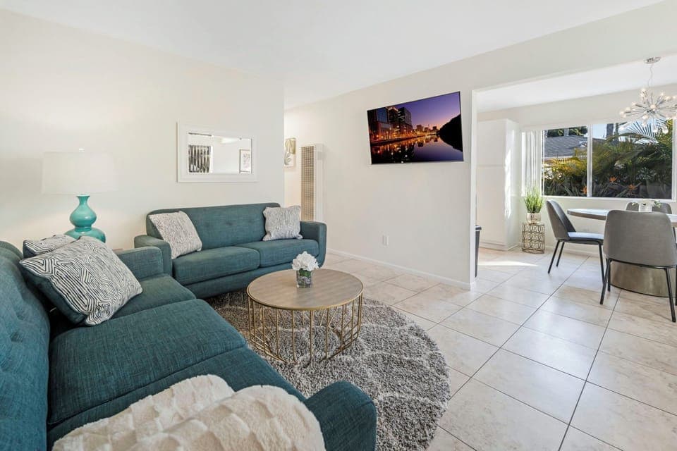 Walk in through the front door straight into the living room with a smart TV