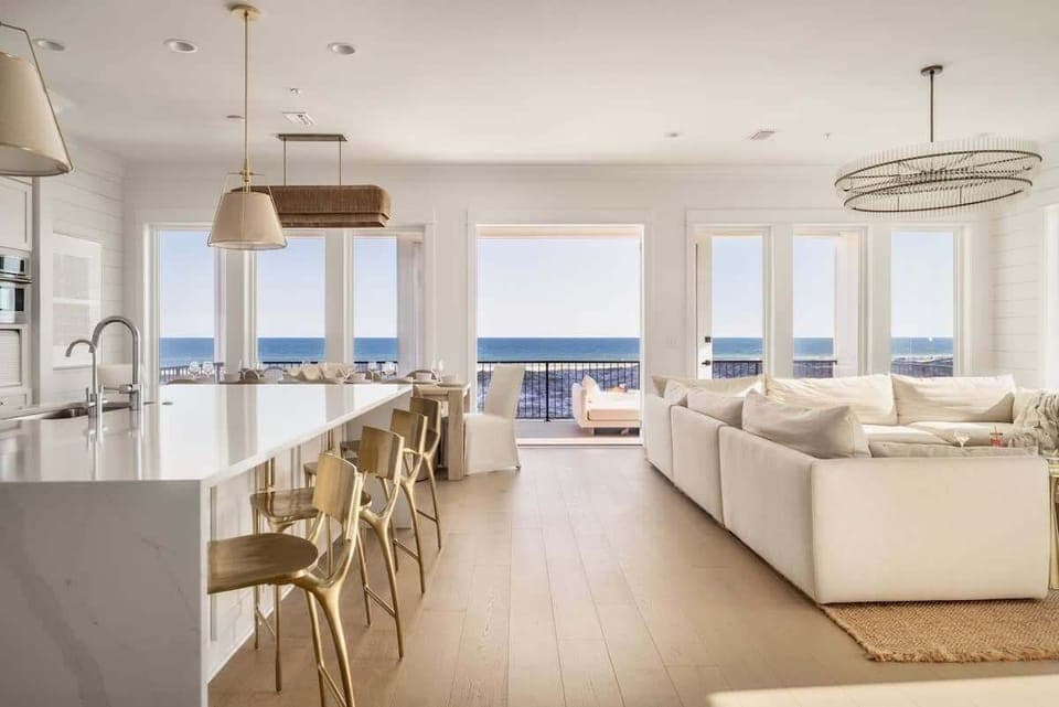 Main floor living area with balcony and ocean views