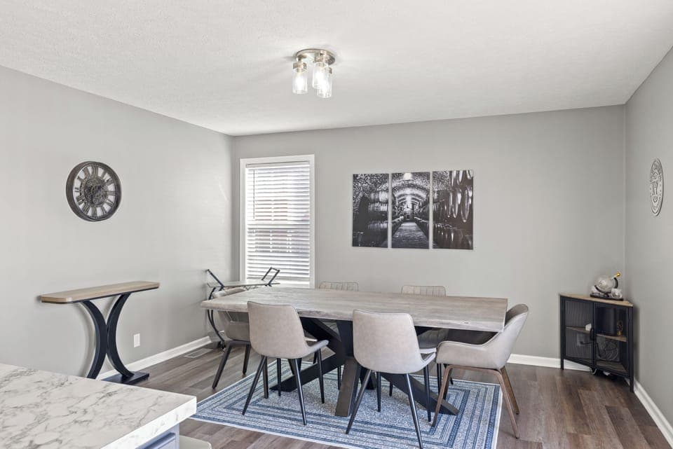 Large dining room table with seating for 6.