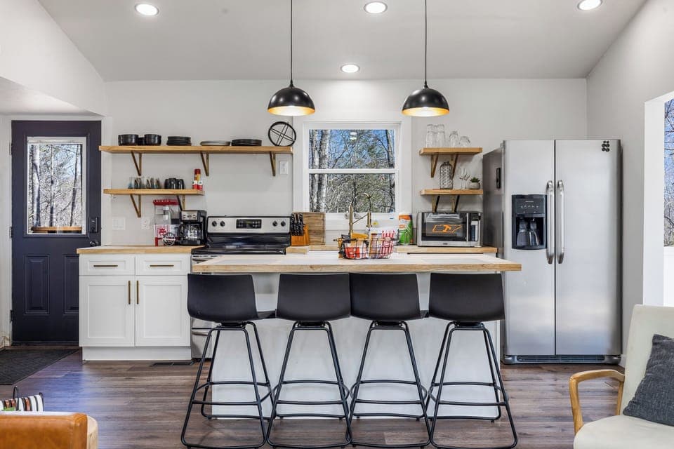 ample seating with stools and dining area