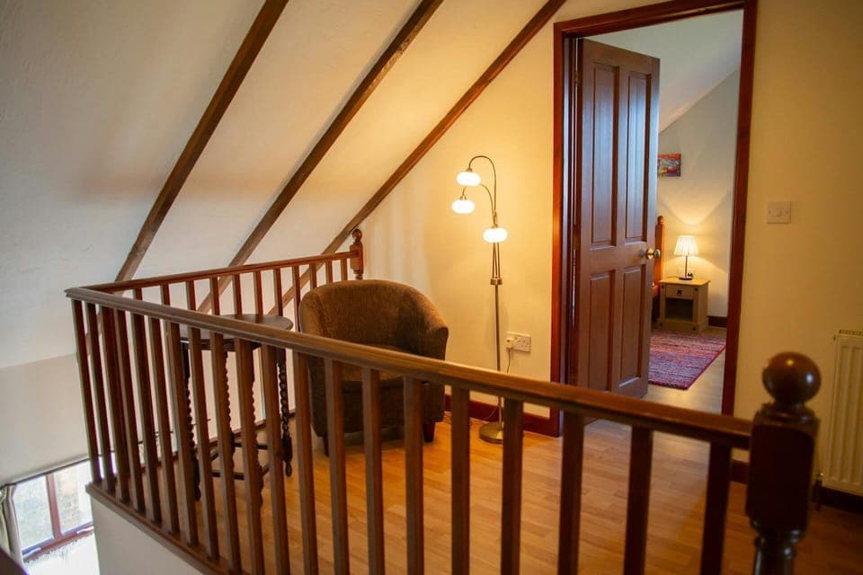 Landing with arm chair and floor lamp