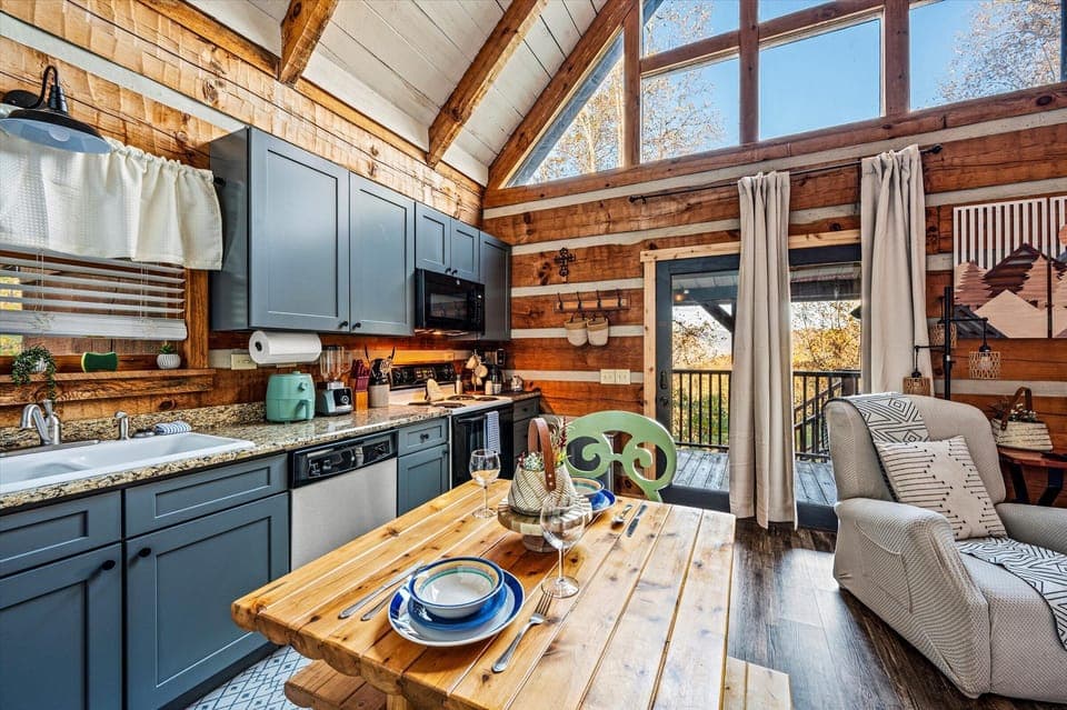 Cook in this fully equipped kitchen w/ modern appliances and rustic cabin decor.