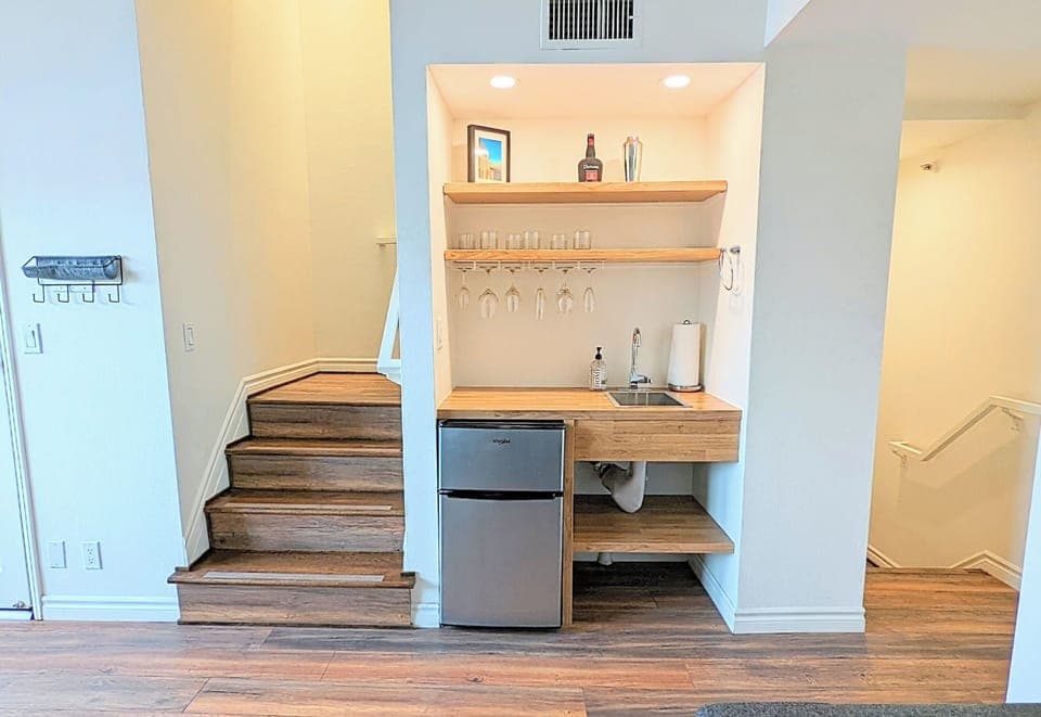 Mini Bar in the Living Room. Stairs lead up to the Bedroom & down to the Kitchen